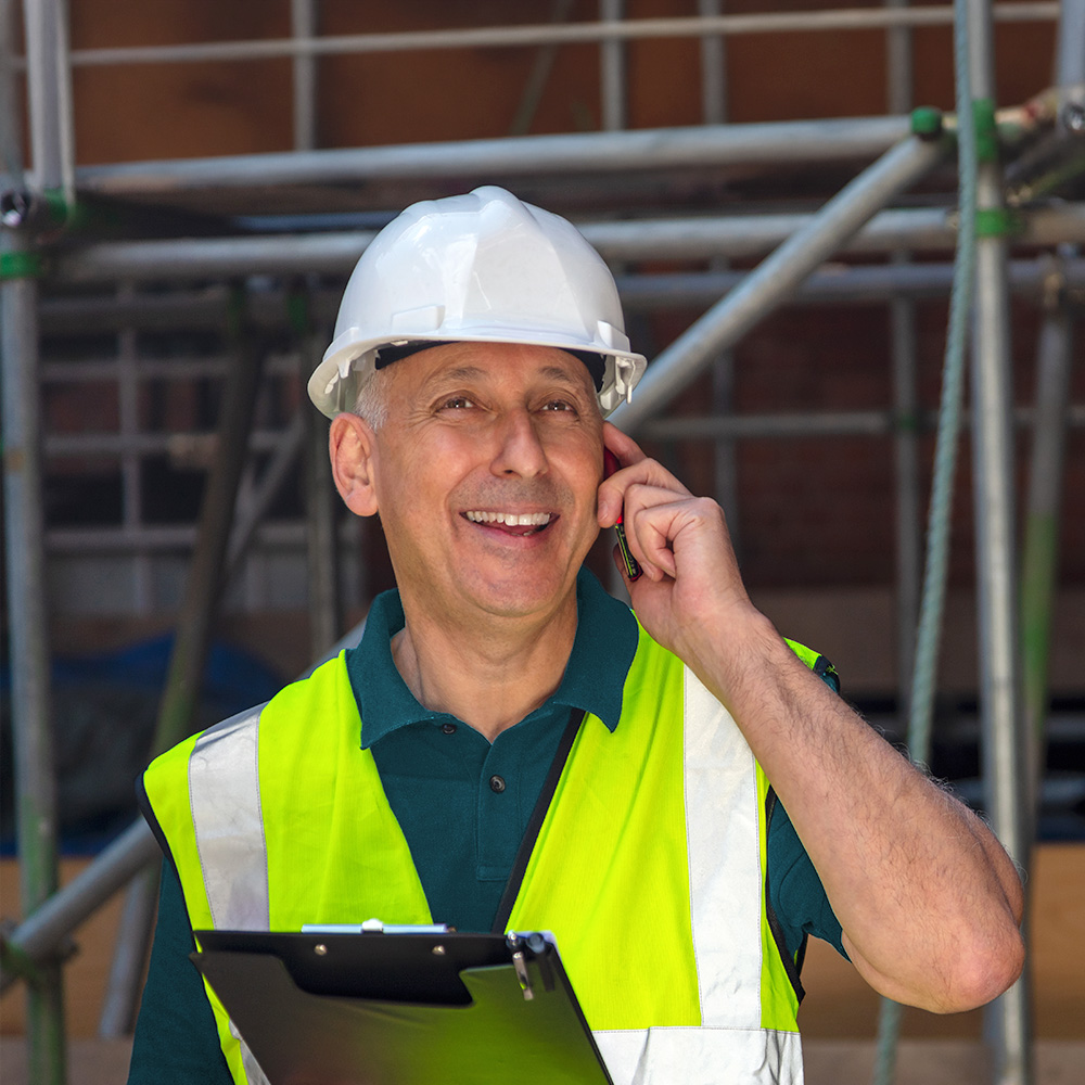 Getting the Right Payments Back on Track Tradesperson talking on a mobile phone
